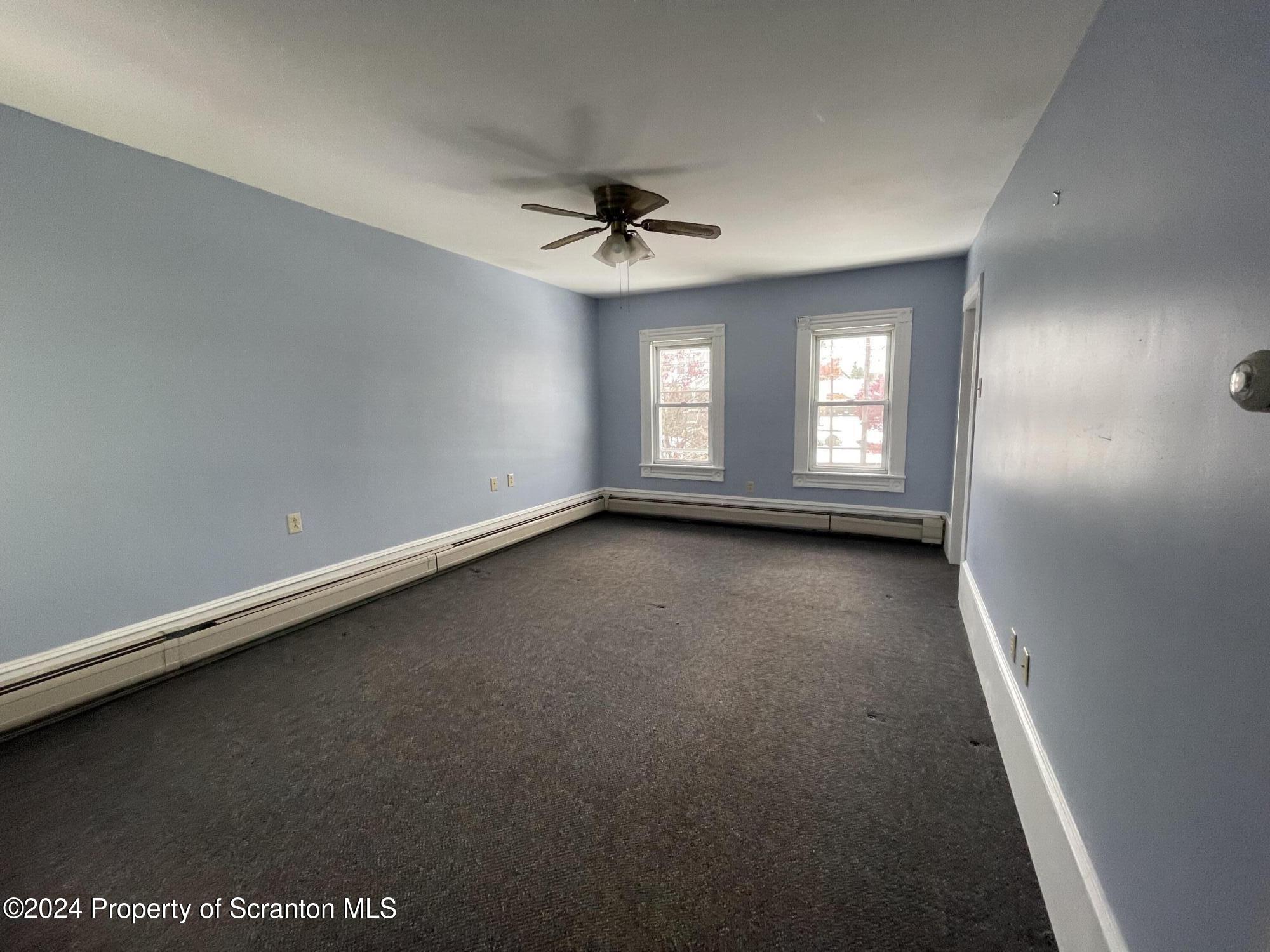 1230 Providence Road, Unit 2 Scranton, PA 18508 - Photo 6 of 10 an empty room with windows and fan
