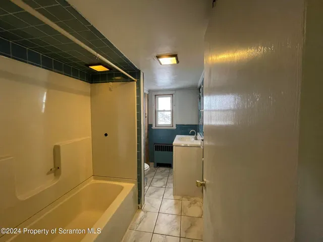 a bathroom with a bathtub