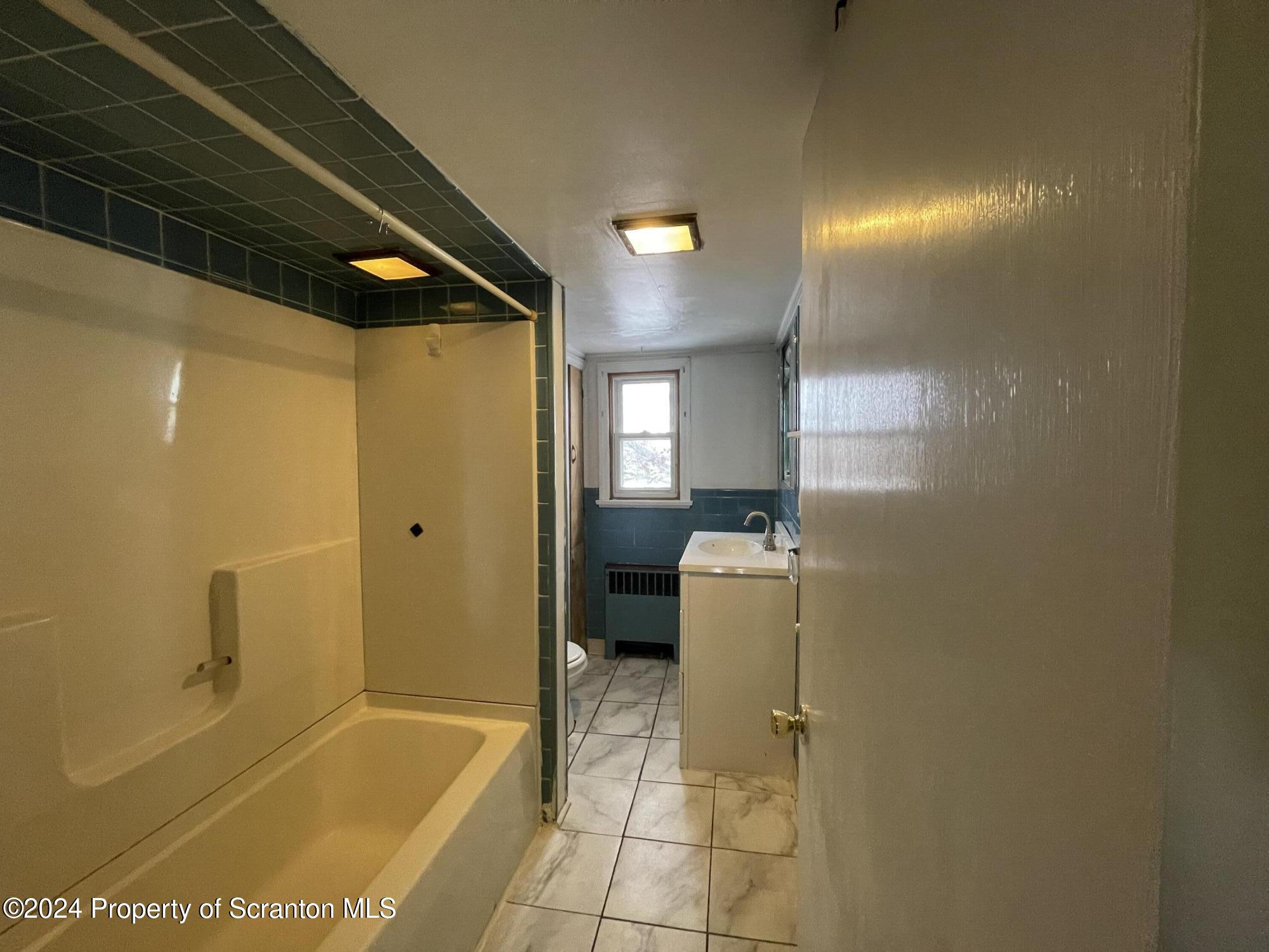 1230 Providence Road, Unit 2 Scranton, PA 18508 - Photo 10 of 10 a bathroom with a bathtub