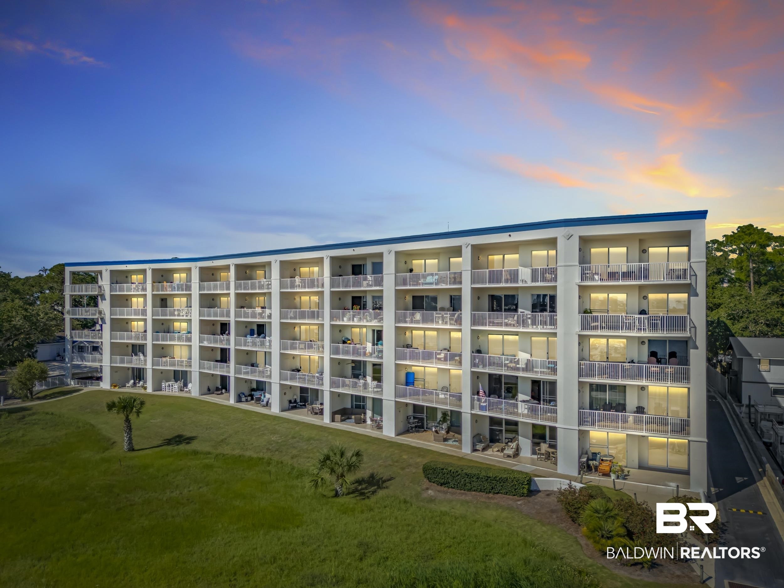 27282 Canal Road, Unit 104 Orange Beach, AL 36561 - Photo 78 of 79 Property at dusk featuring a view of apartment building / complex