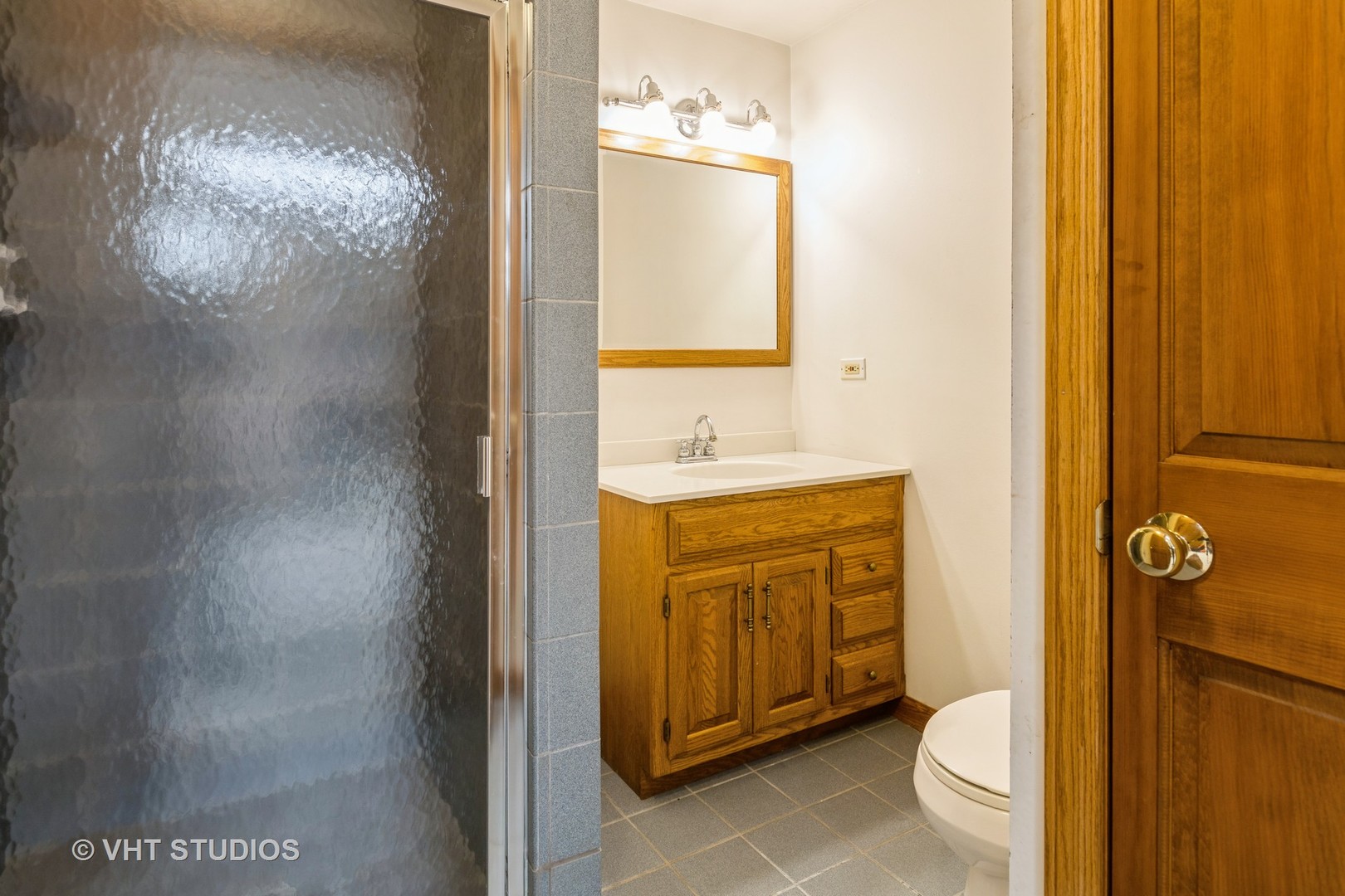 1532 Sequoia Road Naperville, IL 60540 - Photo 13 of 34 a bathroom with a sink a toilet and shower