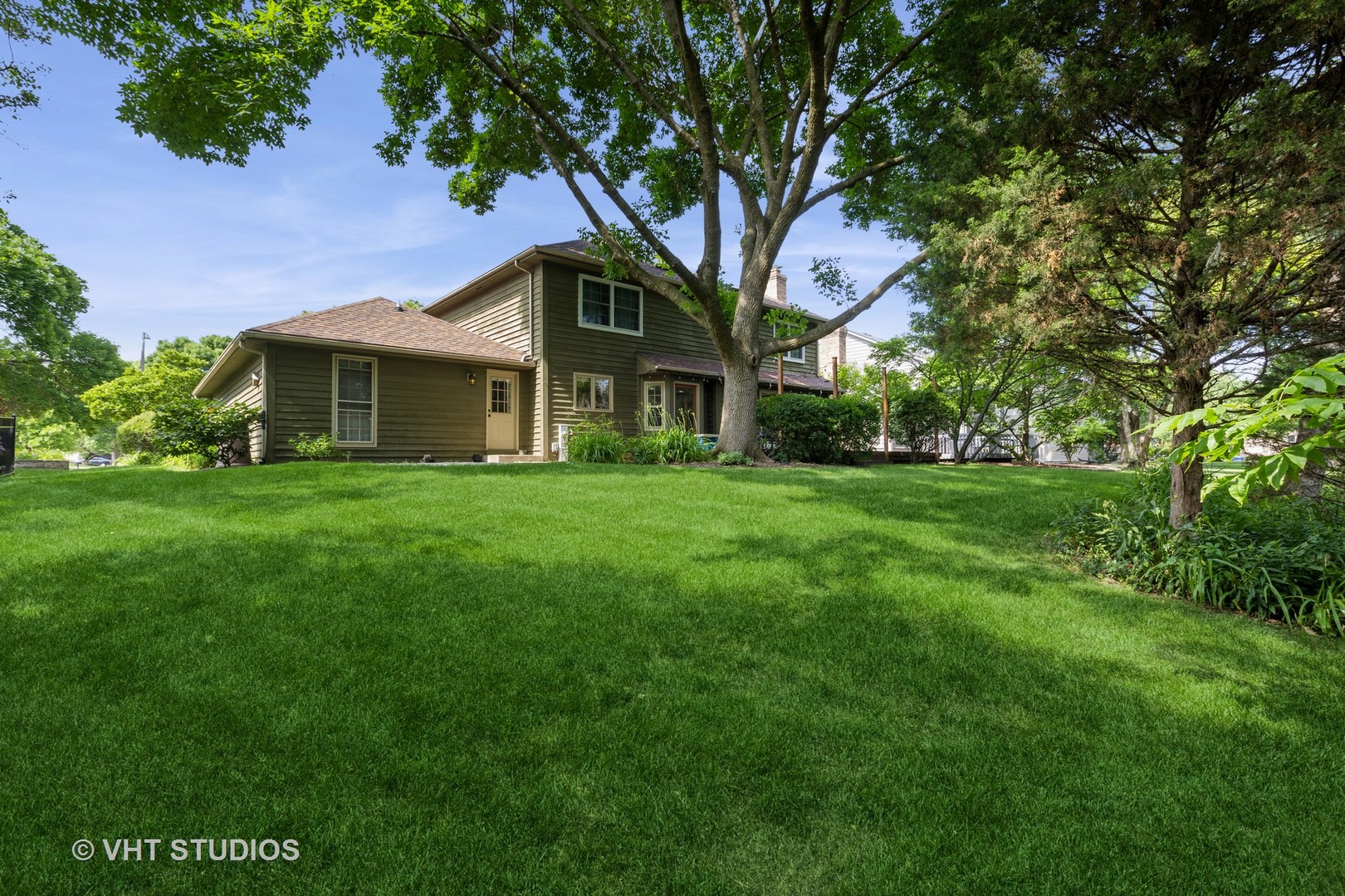 1532 Sequoia Road Naperville, IL 60540 - Photo 2 of 34 a front view of a house with a garden