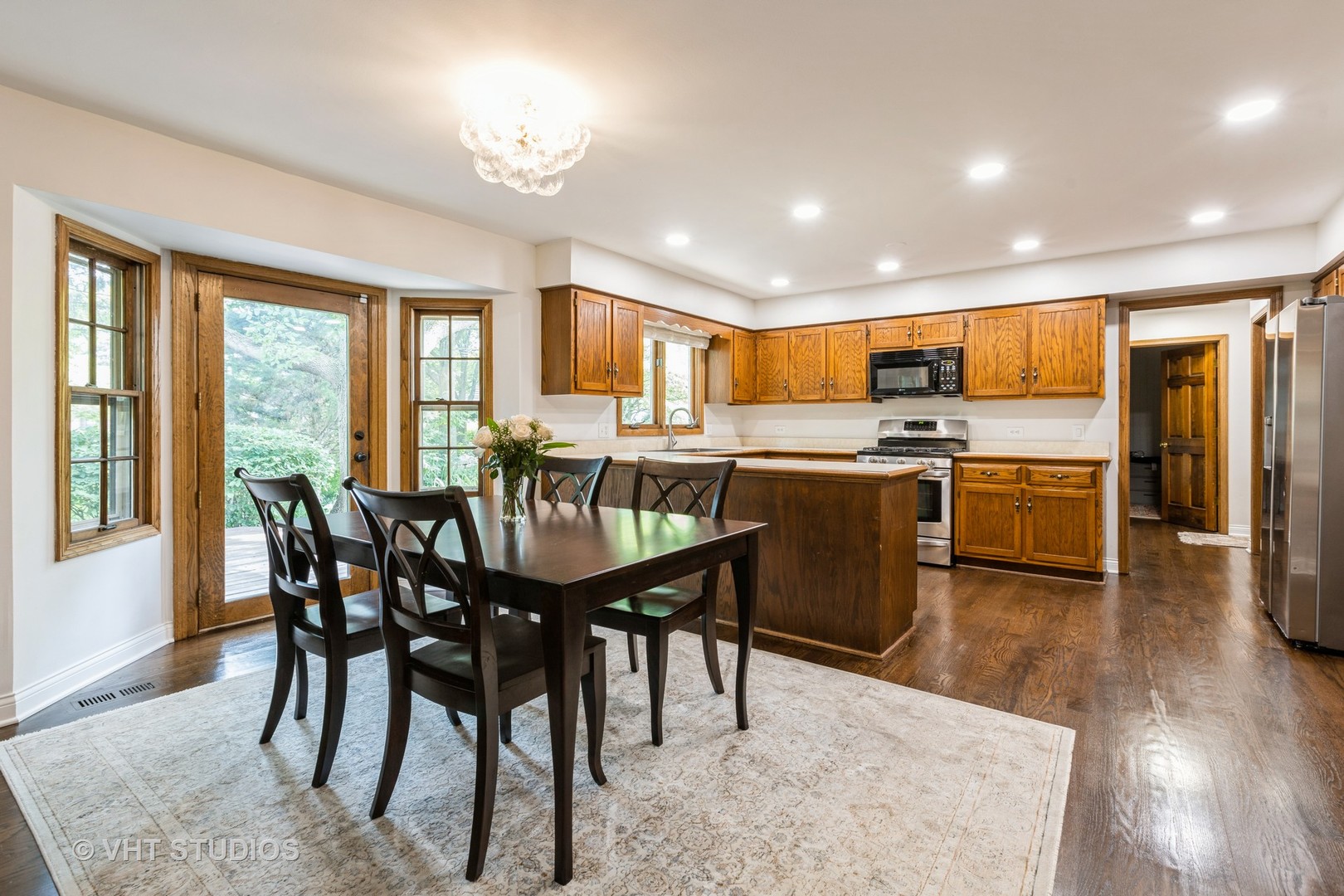 1532 Sequoia Road Naperville, IL 60540 - Photo 8 of 34 a view of a dining room with furniture and wooden floor