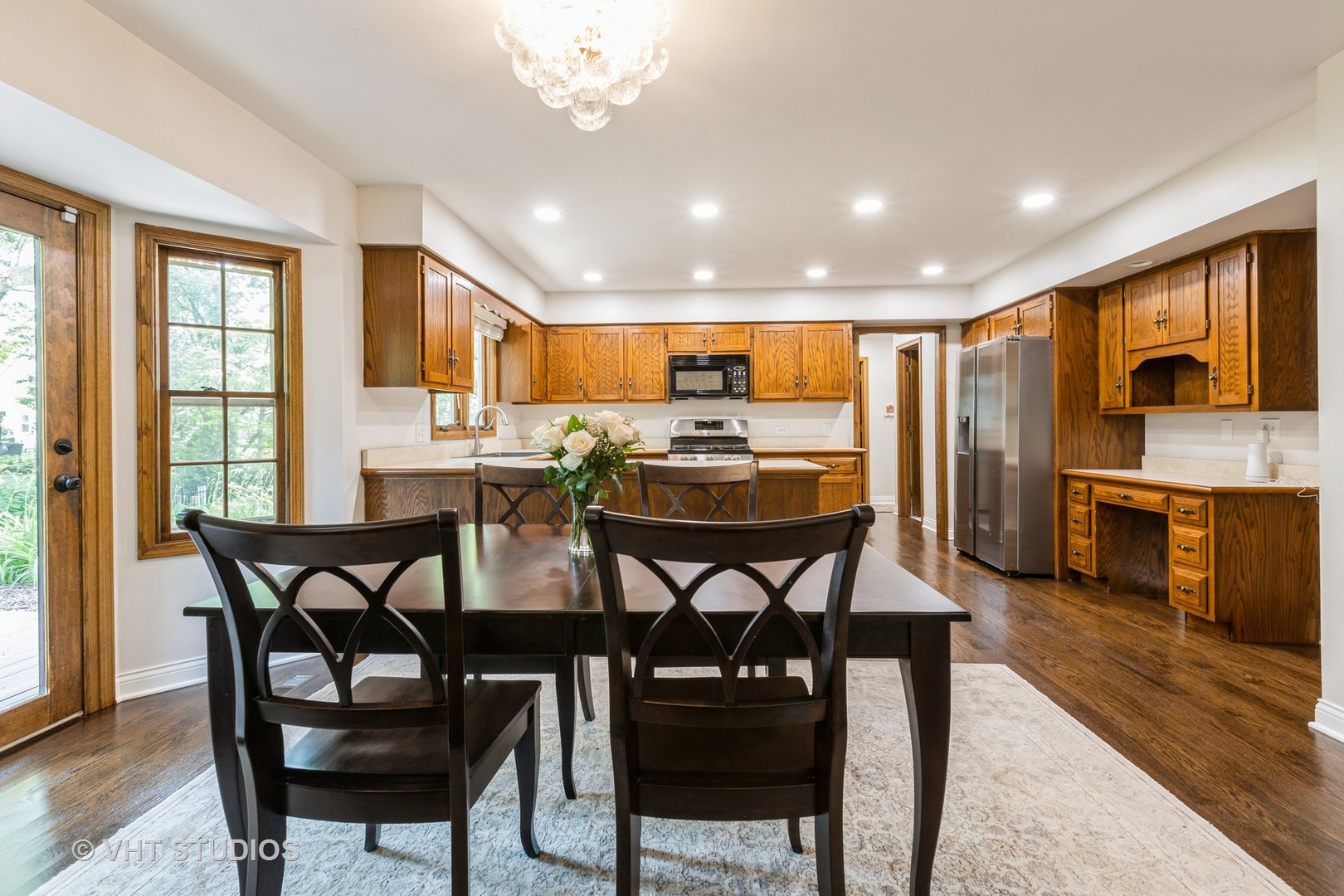 1532 Sequoia Road Naperville, IL 60540 - Photo 9 of 34 a view of a dining room with furniture and wooden floor