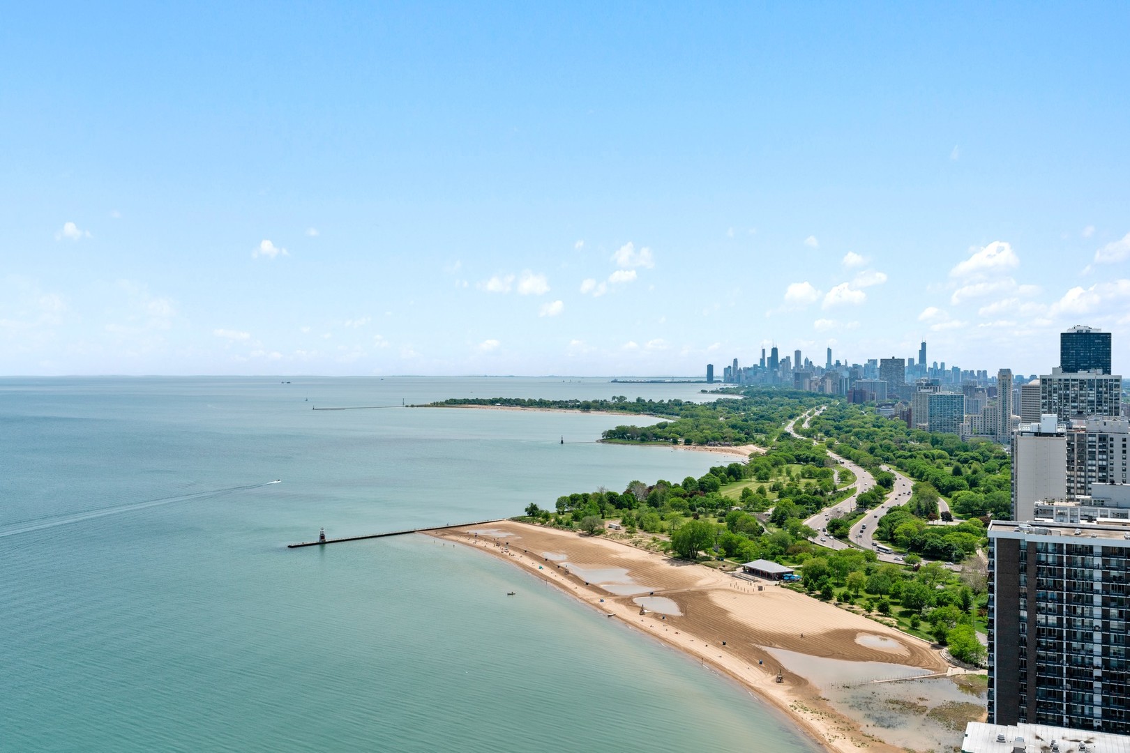 6007 North Sheridan Road, Unit 39C Chicago, IL 60660 - Photo 2 of 19 a view of a lake with a city