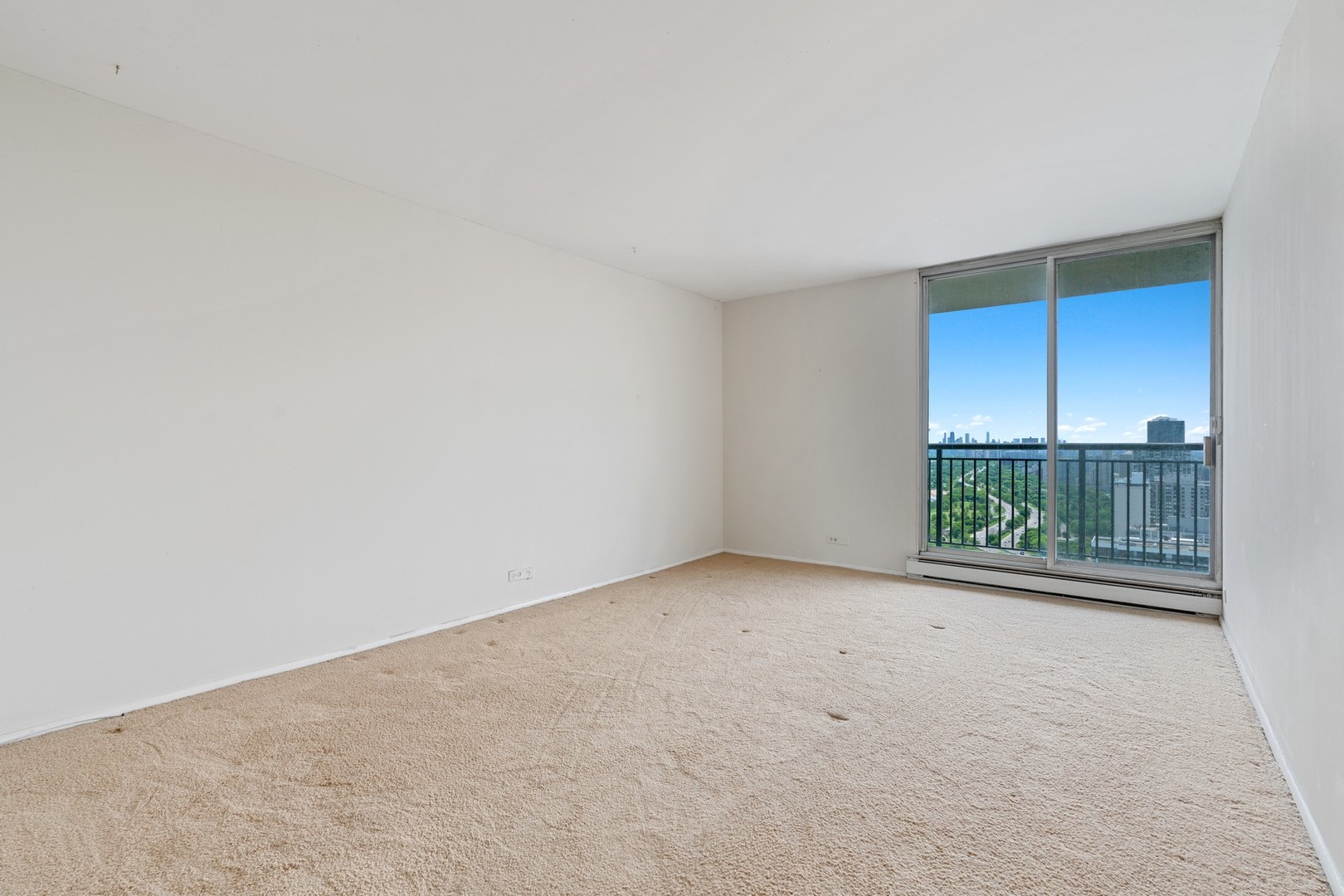 6007 North Sheridan Road, Unit 39C Chicago, IL 60660 - Photo 12 of 19 an empty room with glass door and balcony