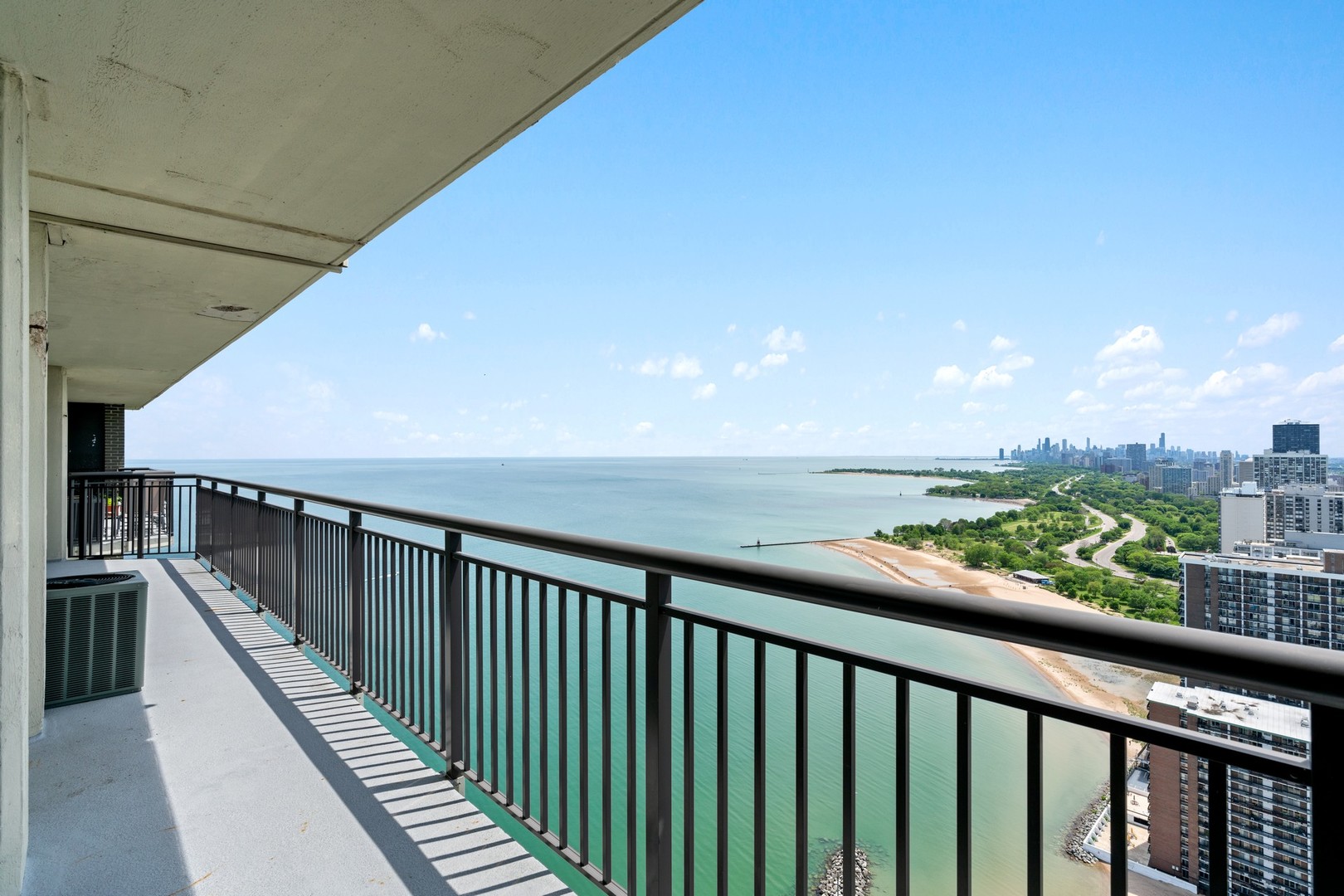6007 North Sheridan Road, Unit 39C Chicago, IL 60660 - Photo 4 of 19 a balcony with wooden floor