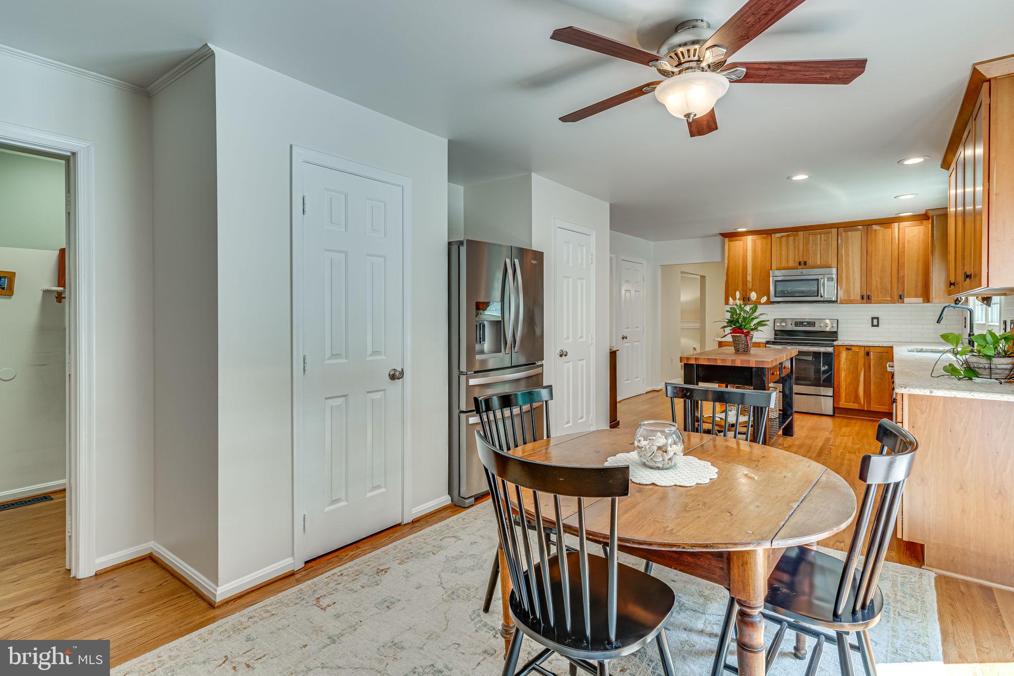 9741 Howes Road Dunkirk, MD 20754 - Photo 16 of 48 a view of a dining room with furniture