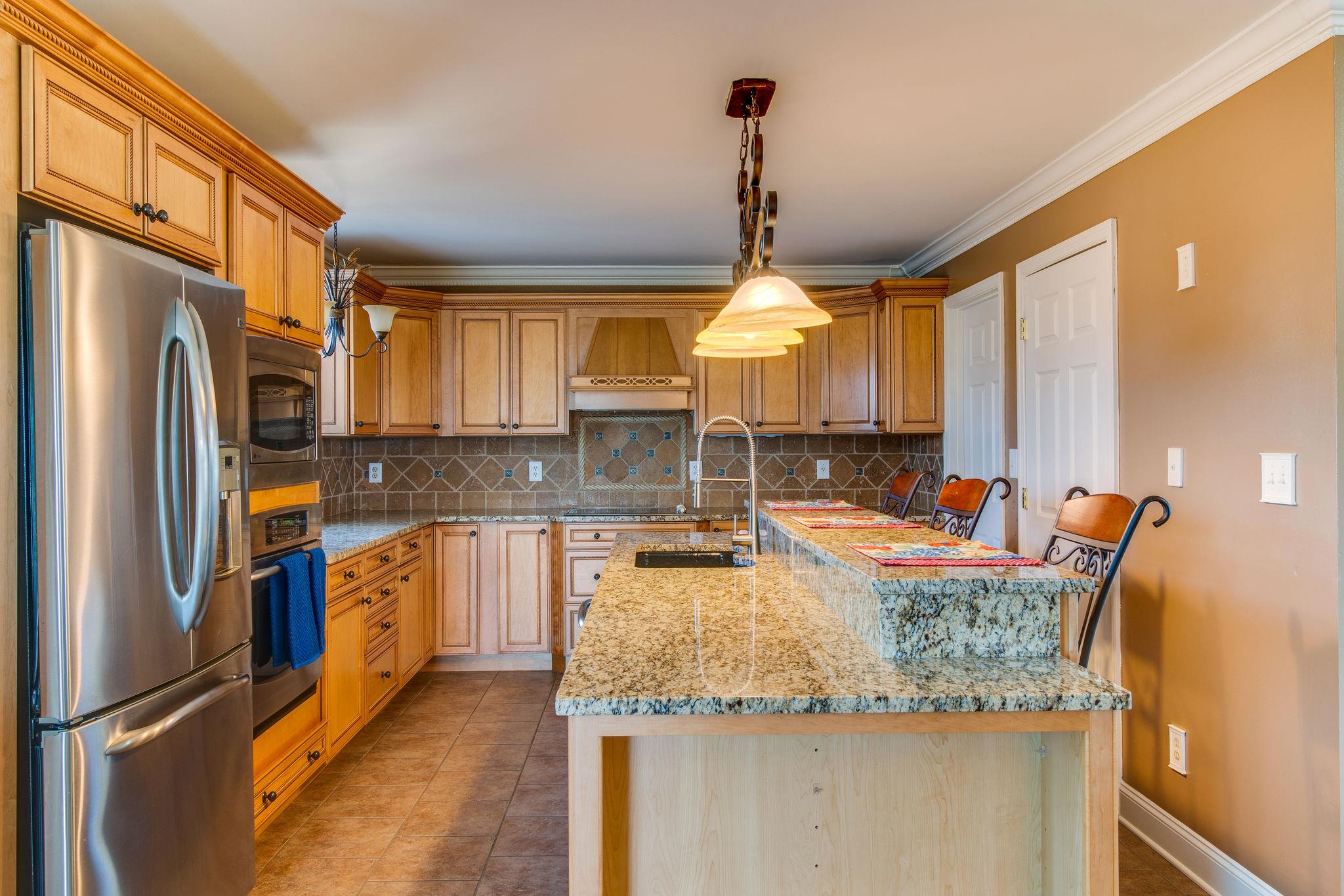 3015 Lowry Road Lewisburg, TN 37091 - Photo 9 of 30 Kitchen has custom cabinets - tile -granite and beautiful back splash