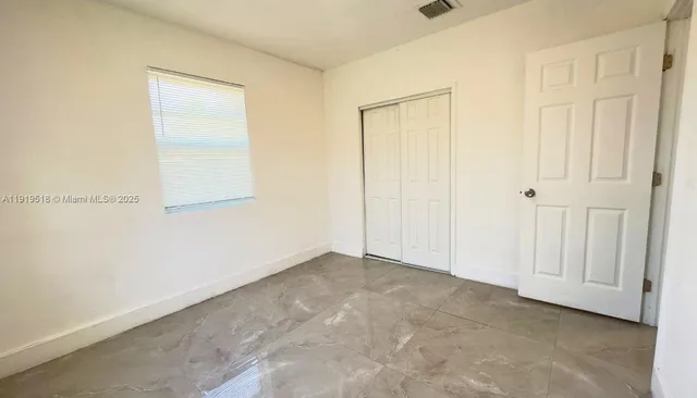 an empty room with a door