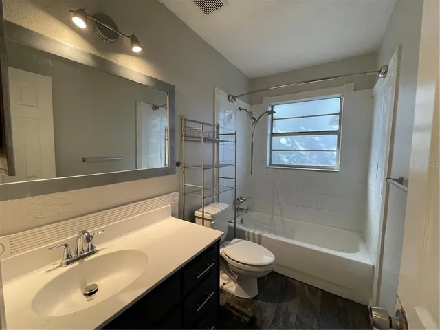 a bathroom with a sink toilet a shower and a bathtub