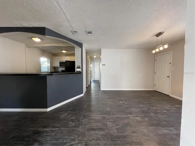a view of a kitchen with a sink and cabinets