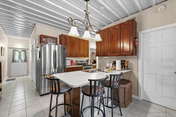 a kitchen with a table and chairs