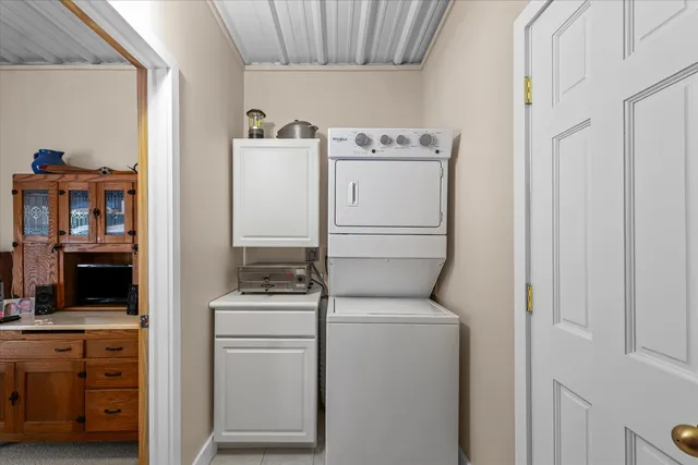 a bedroom with a bed and a mirror