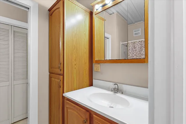 a view of a bathroom from a hallway