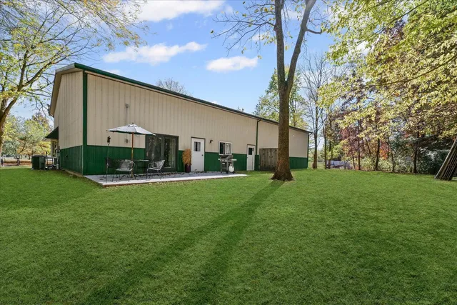 a view of a backyard with large trees