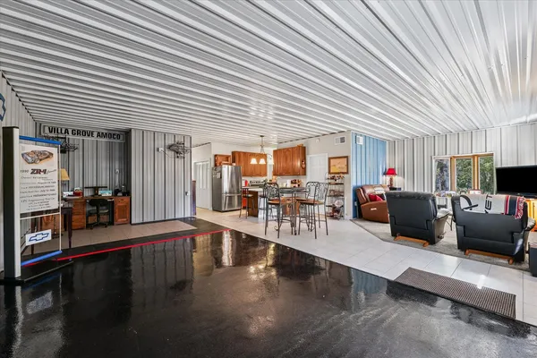 a dining room with furniture and a window