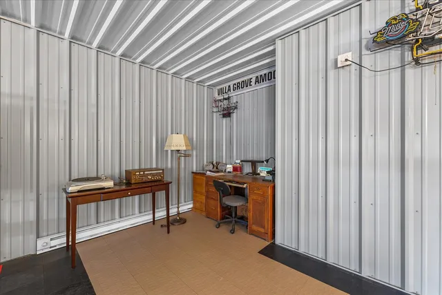 a lobby with furniture and floor to ceiling window