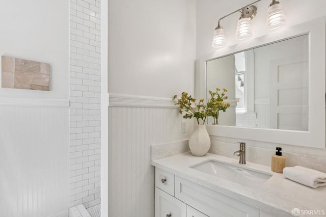 a kitchen with a sink stove and refrigerator
