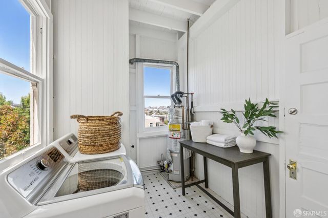 a view of a house with a yard porch and sitting area