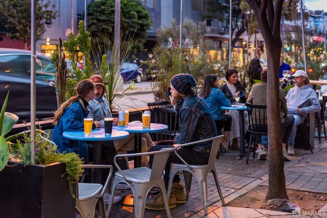 a sign on a pole on a street
