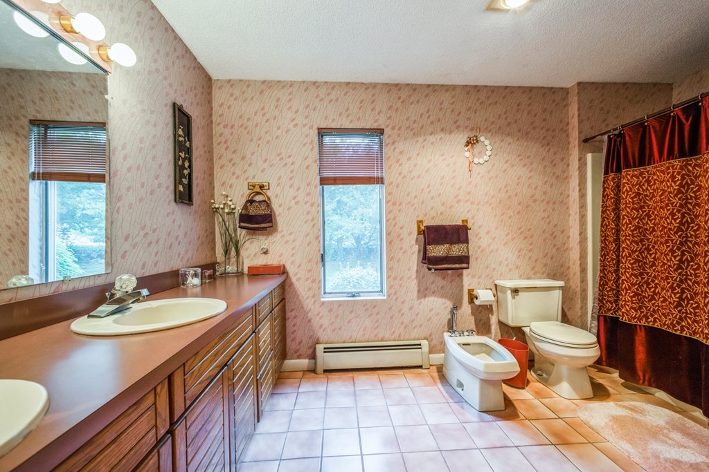 210 Ipswich Road Boxford, MA 01921 - Photo 12 of 33 a spacious bathroom with a double vanity sink toilet and a tub