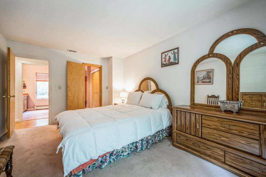 210 Ipswich Road Boxford, MA 01921 - Photo 13 of 33 a bedroom with bed and a sink