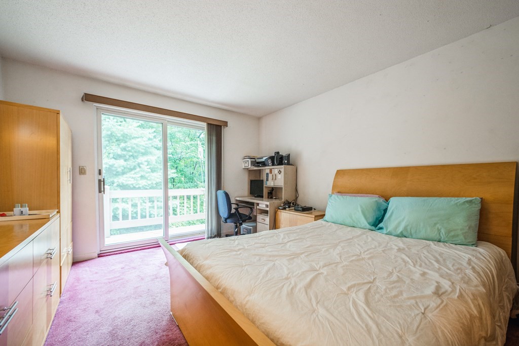 210 Ipswich Road Boxford, MA 01921 - Photo 16 of 33 a bedroom with a large bed and a large window