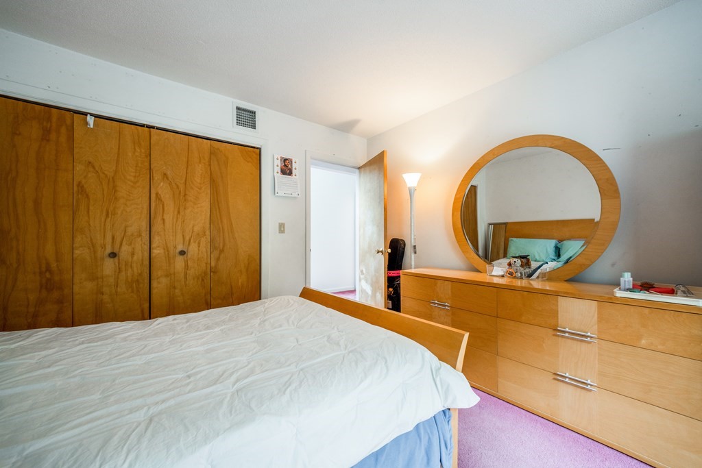 210 Ipswich Road Boxford, MA 01921 - Photo 17 of 33 a bedroom with a bed and a dresser