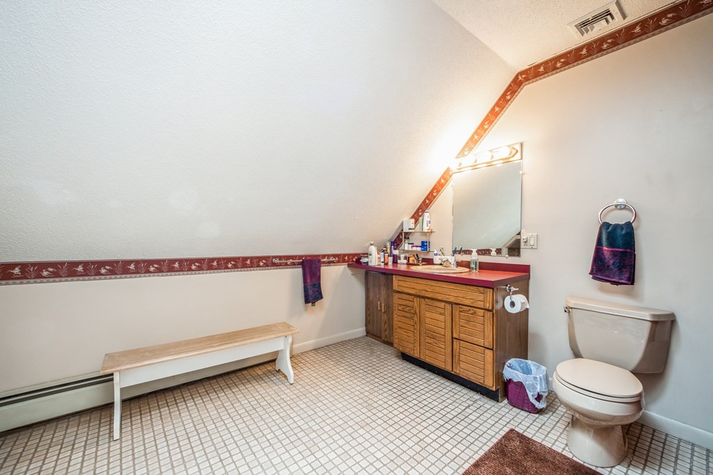 210 Ipswich Road Boxford, MA 01921 - Photo 18 of 33 a bathroom with a sink a toilet and a mirror