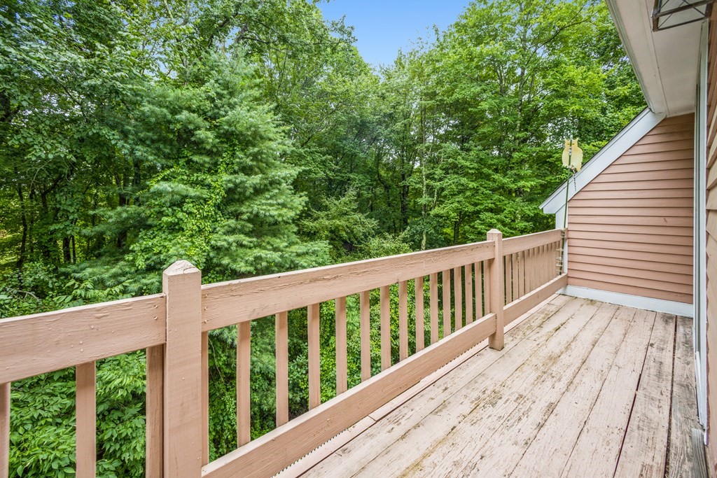 210 Ipswich Road Boxford, MA 01921 - Photo 21 of 33 a balcony with wooden floor and fence