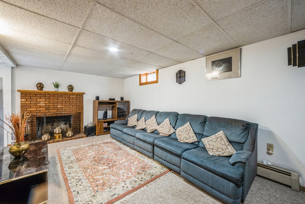210 Ipswich Road Boxford, MA 01921 - Photo 22 of 33 a living room with furniture and a fireplace