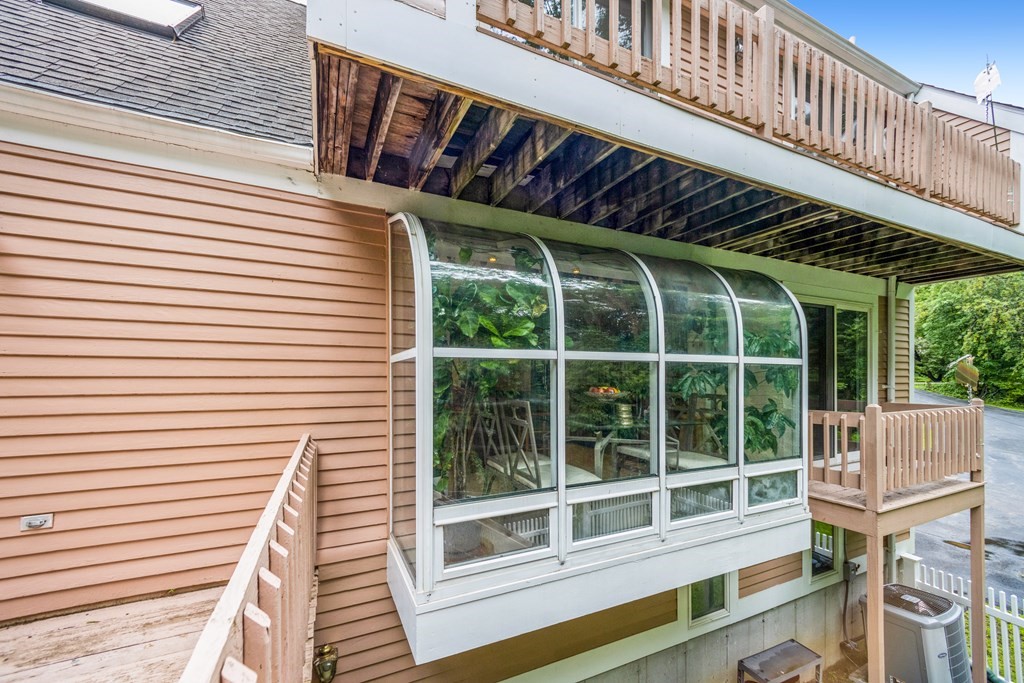 210 Ipswich Road Boxford, MA 01921 - Photo 27 of 33 a view of a chair and table in the balcony