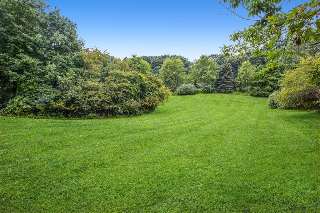210 Ipswich Road Boxford, MA 01921 - Photo 32 of 33 a view of a grassy field with trees