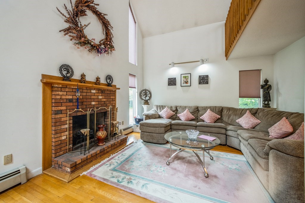210 Ipswich Road Boxford, MA 01921 - Photo 4 of 33 a living room with furniture and a fireplace