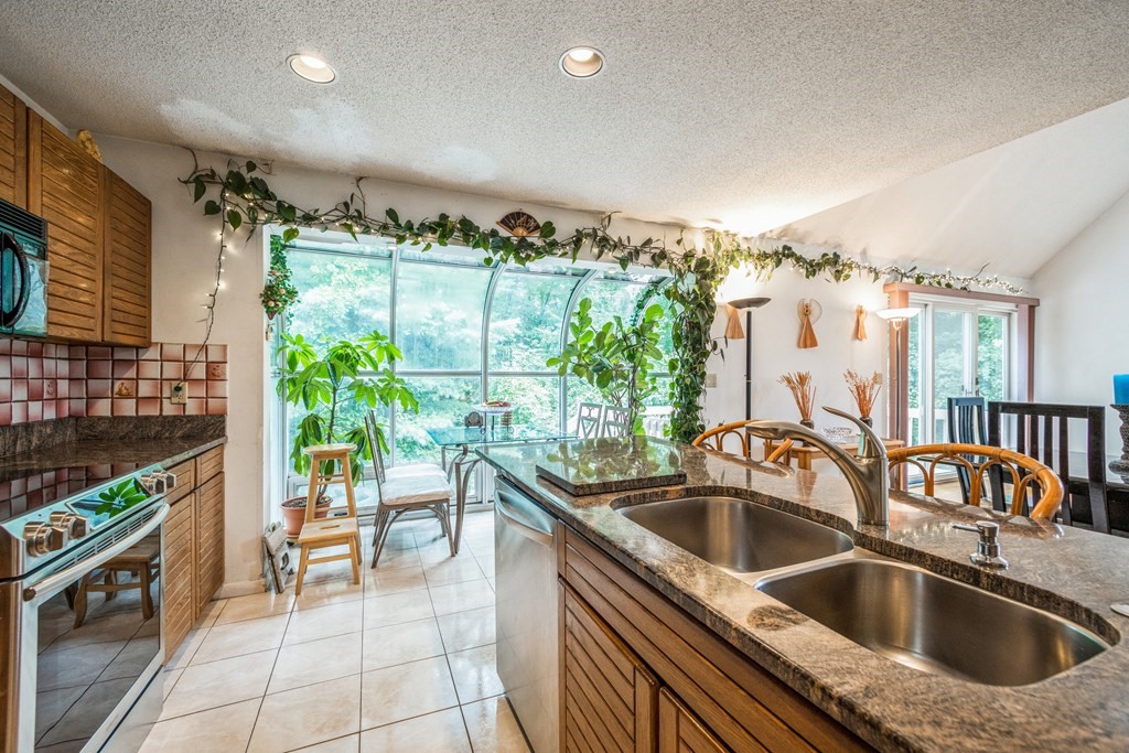 210 Ipswich Road Boxford, MA 01921 - Photo 9 of 33 a kitchen with a sink and a refrigerator