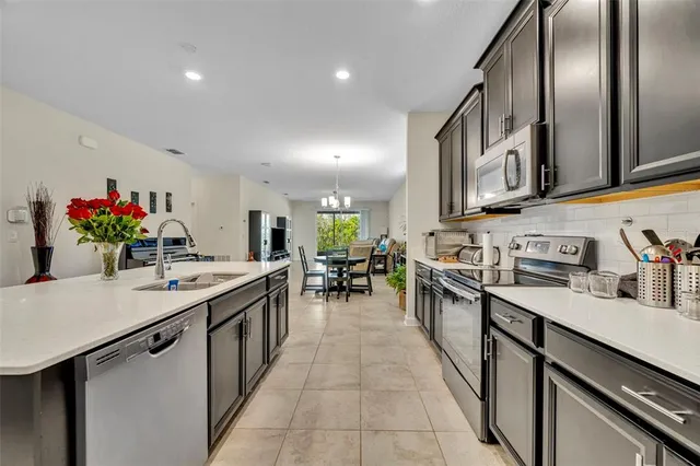 a kitchen with stainless steel appliances lots of counter top space