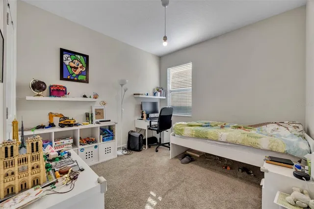 a bathroom with a granite countertop sink a toilet and a mirror