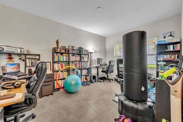 a view of a workspace with furniture and a workspace