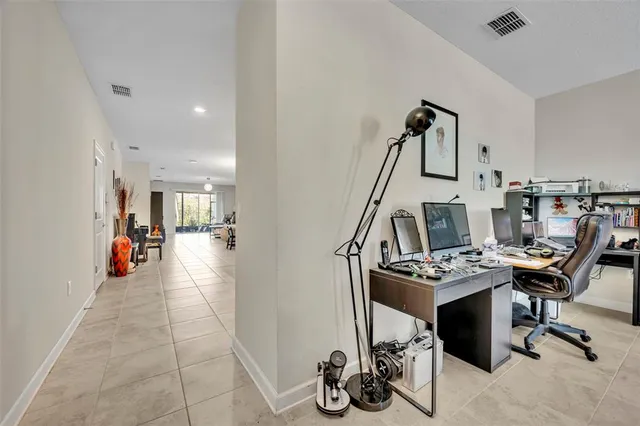 a view of a garden with a building in the background