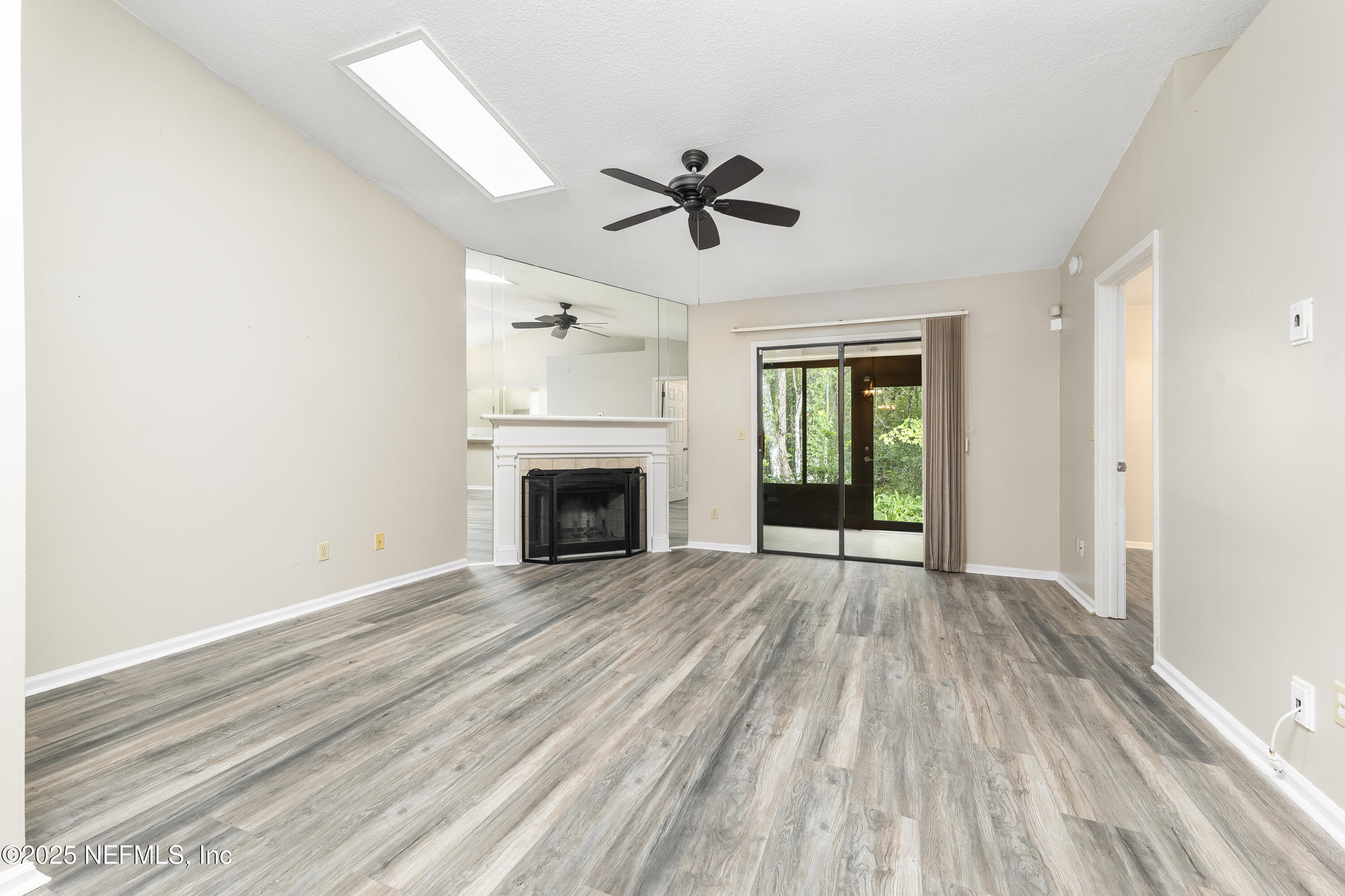 85 Debarry Avenue, Unit 3021 Orange Park, FL 32073 - Photo 15 of 35 a view of empty room with wooden floor and fan