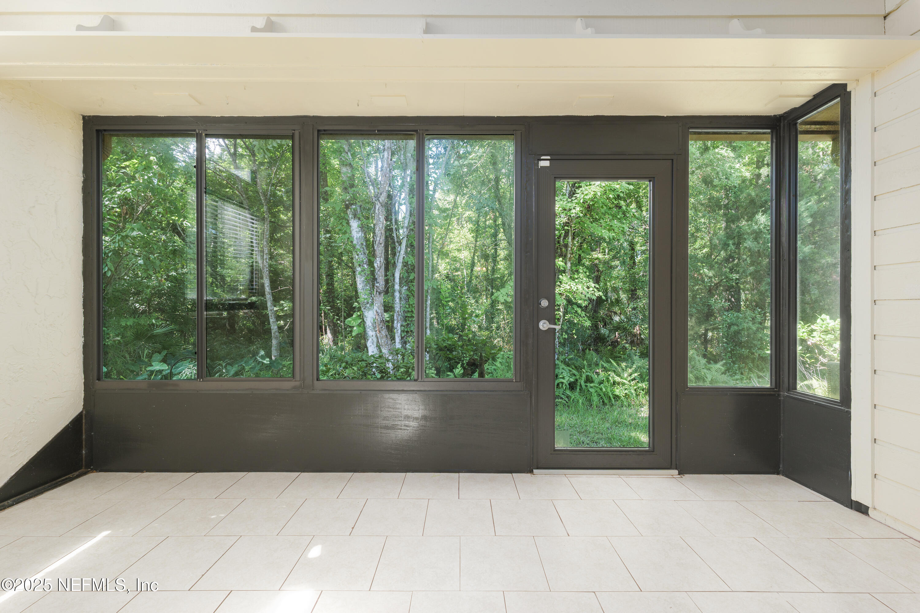 85 Debarry Avenue, Unit 3021 Orange Park, FL 32073 - Photo 16 of 35 a living room with furniture and large windows