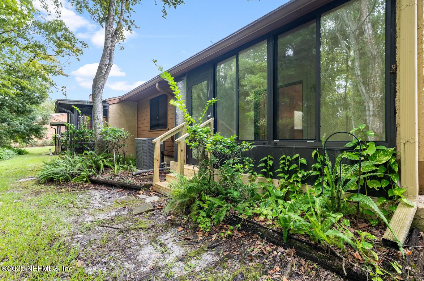 85 Debarry Avenue, Unit 3021 Orange Park, FL 32073 - Photo 32 of 35 a front view of a house with garden