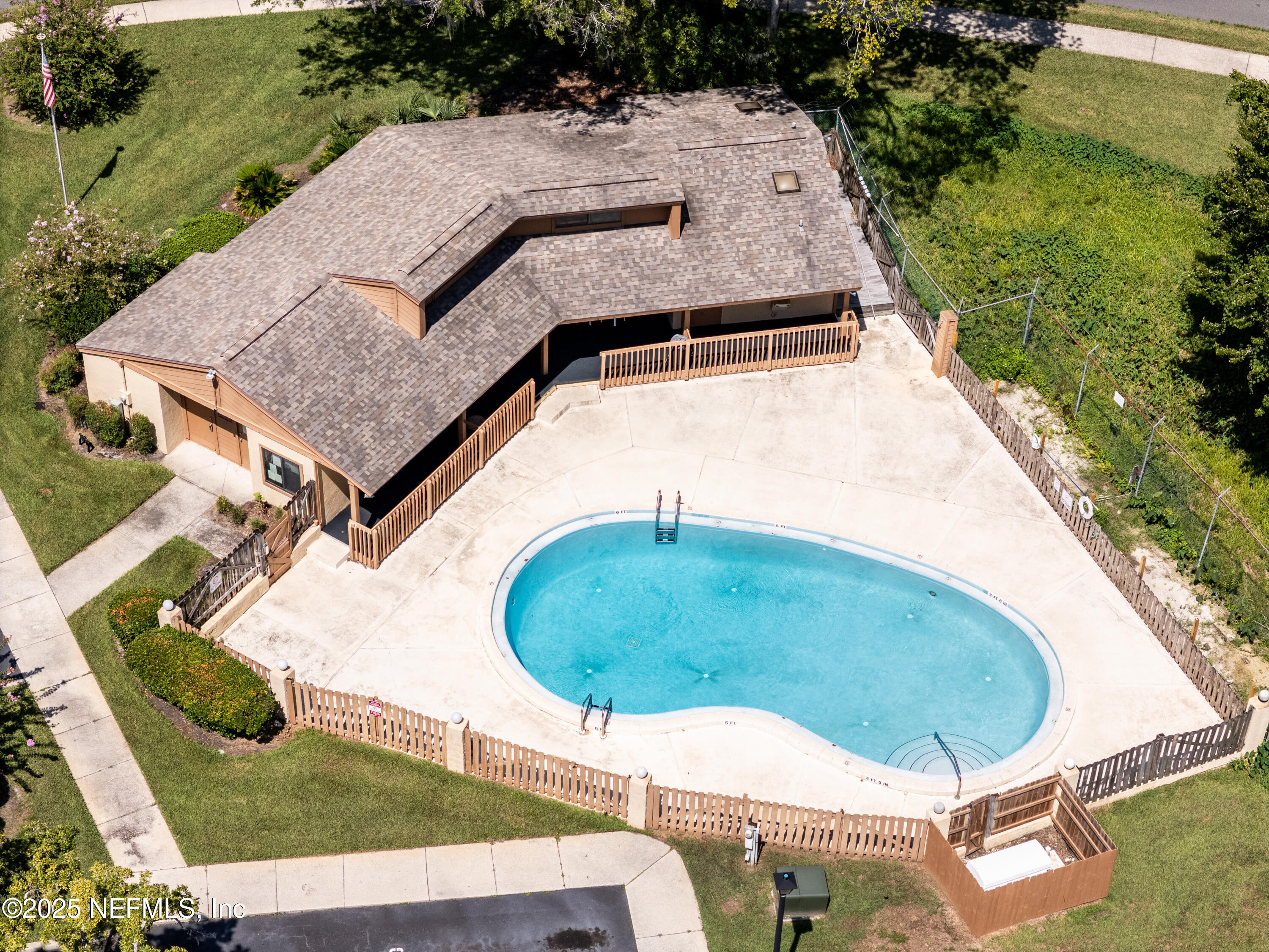 85 Debarry Avenue, Unit 3021 Orange Park, FL 32073 - Photo 34 of 35 an aerial view of a house with a yard and pool