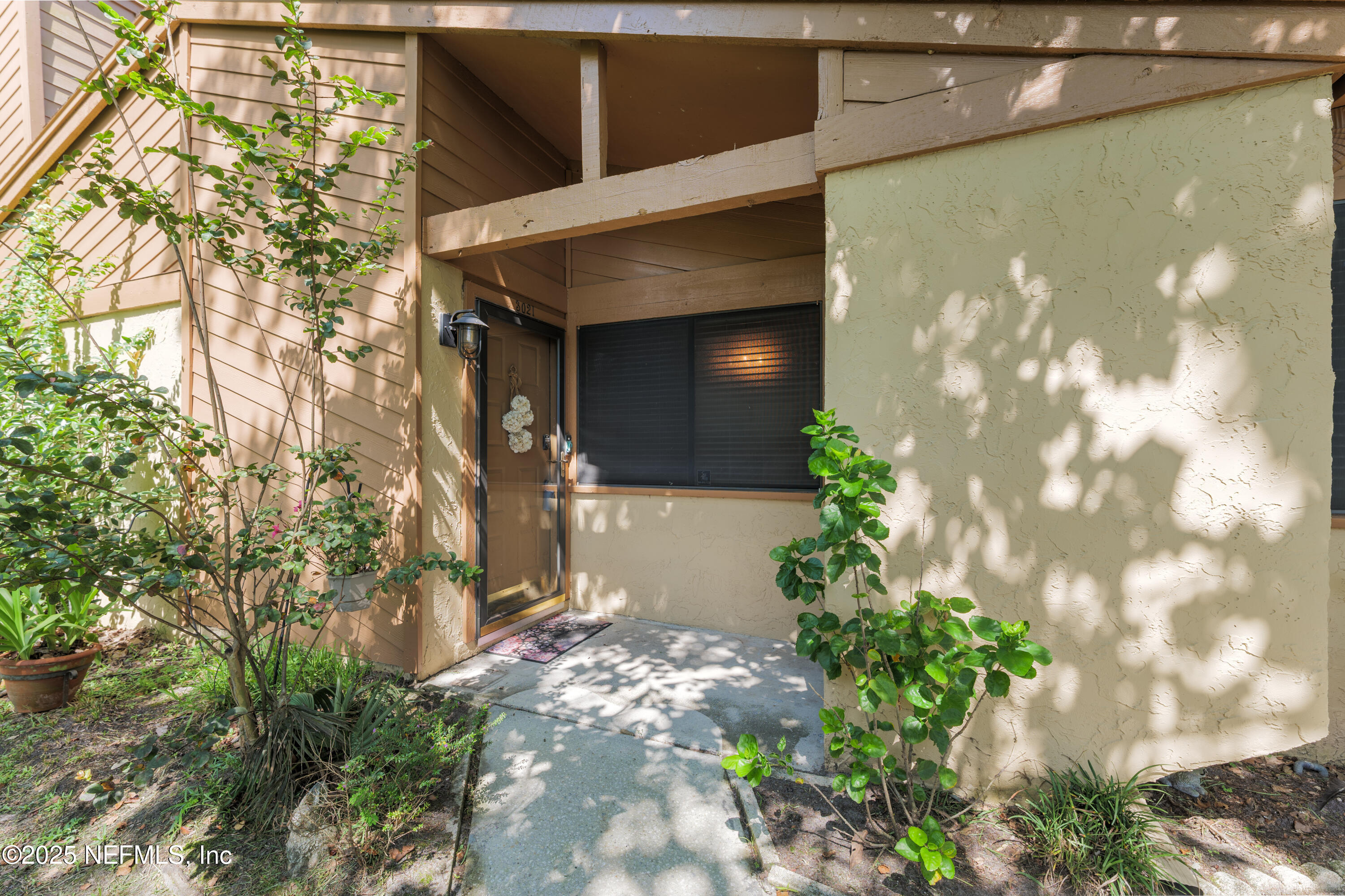 85 Debarry Avenue, Unit 3021 Orange Park, FL 32073 - Photo 4 of 35 a front view of a house with a yard
