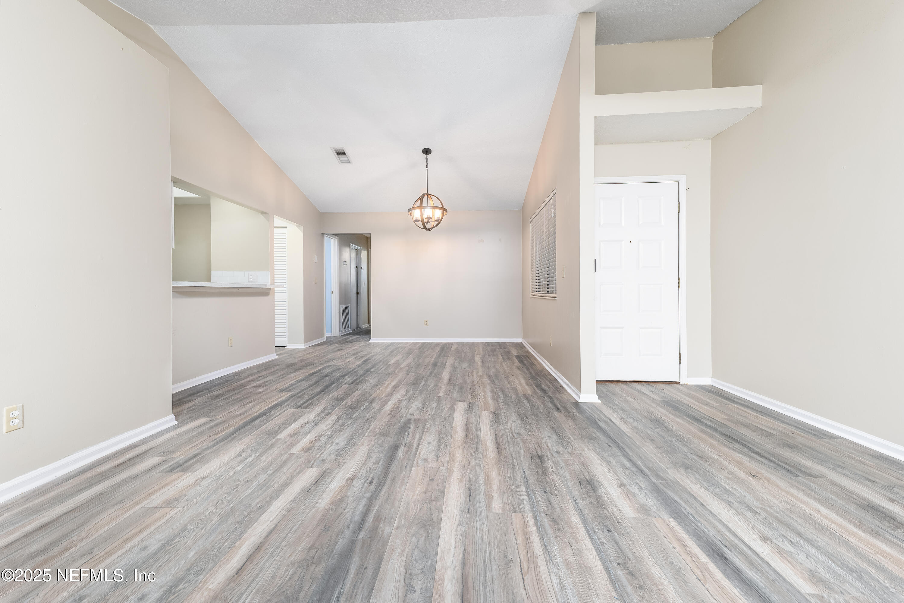 85 Debarry Avenue, Unit 3021 Orange Park, FL 32073 - Photo 9 of 35 a view of empty room with wooden floor