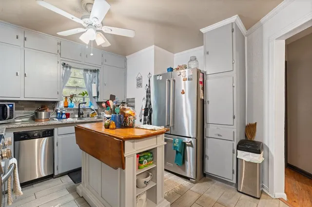 a kitchen that has a lot of cabinets in it