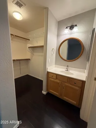 a view of a backyard with a barbeque grill and a garden