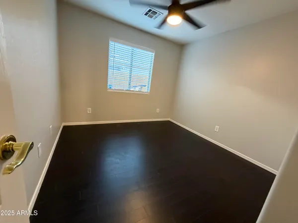 a view of an chairs under an umbrella