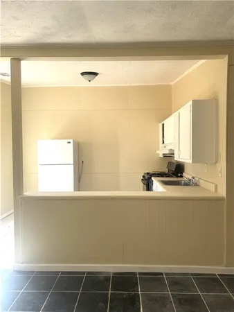 a kitchen with stainless steel appliances a sink and a stove